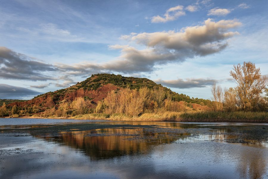 Lake Salagou with red shoreline landscape in the Hérault