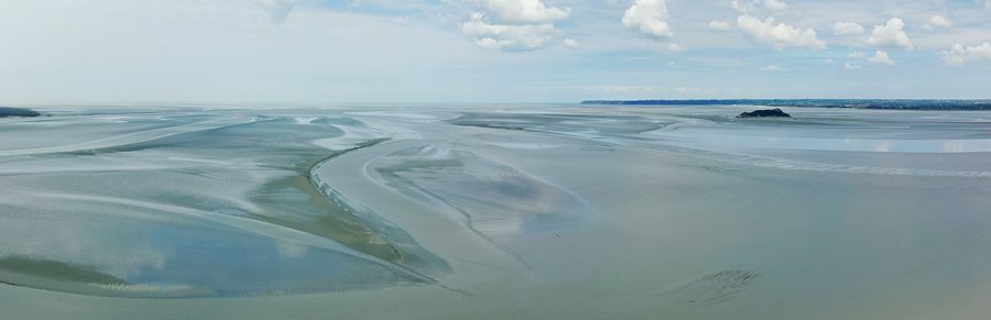 View at low tide over the Bay of Mont-Saint-Michel with Tombelaine