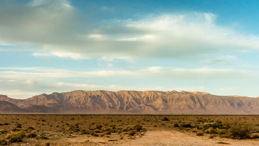 Sandy and rocky desert landscape in the Algerian Sahara between Béchar and Timimoun