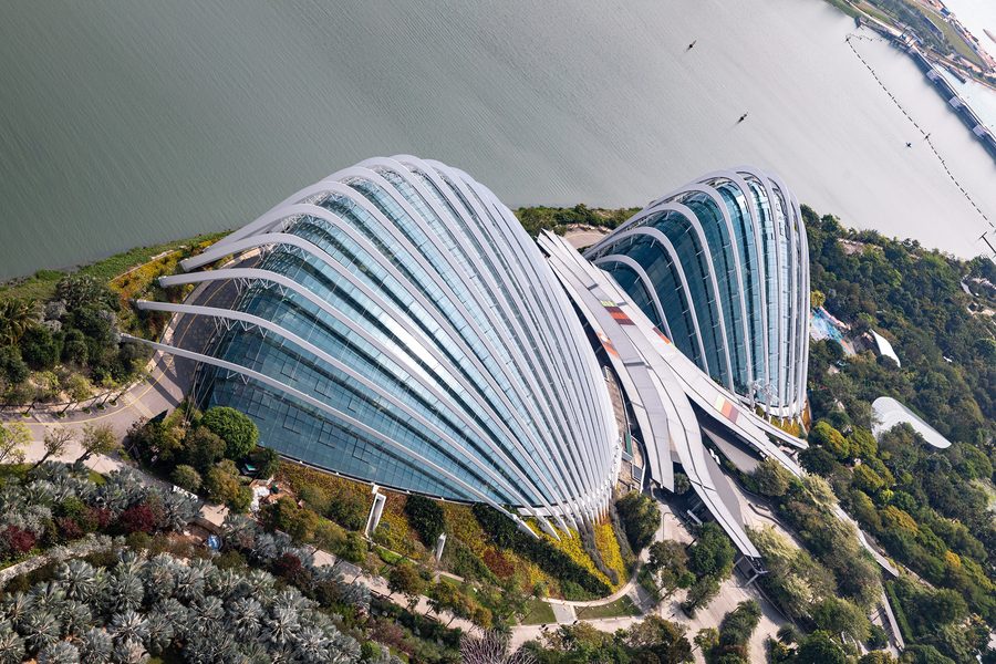 Gardens by the Bay with Cloud Forest and Flower Dome in front of the Singapore skyline