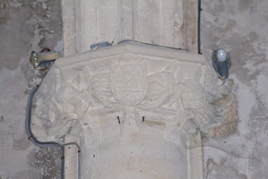 Carved capital in the nave of the church of Saint-Vincent de Réaux, Charente-Maritime