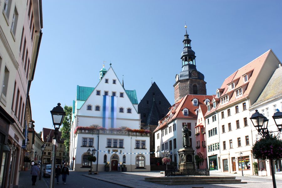 Market square of Lutherstadt Eisleben with town hall, Luther monument, and St. Andrew's Church