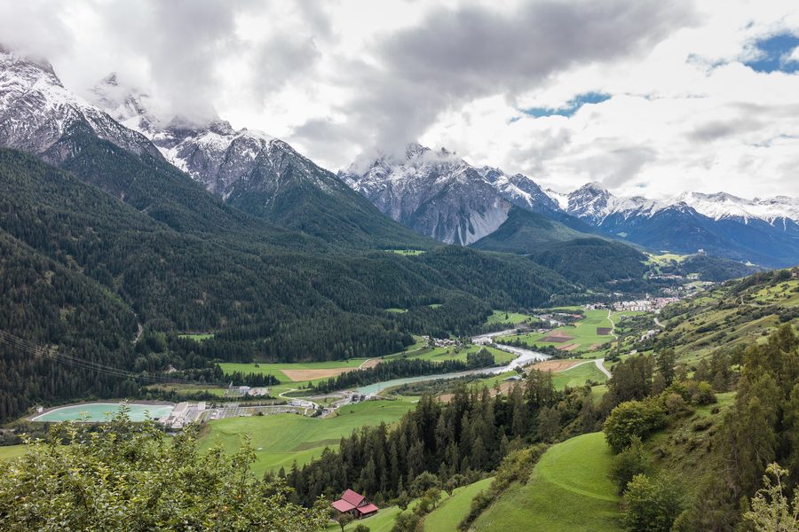 View of Sent in the Lower Engadine with alpine landscape and surrounding villages
