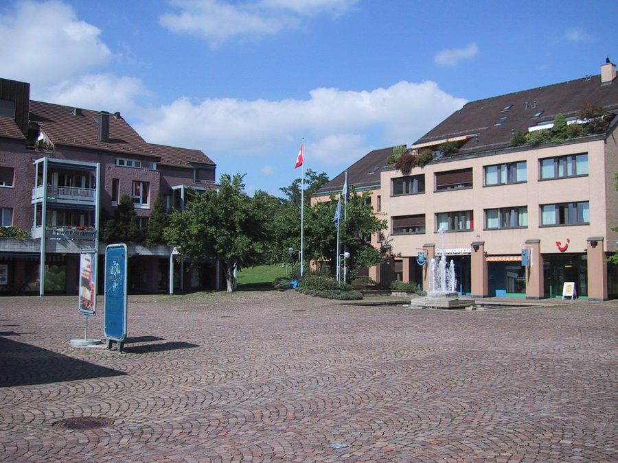 Village square with the municipal building in Zumikon in the canton of Zurich