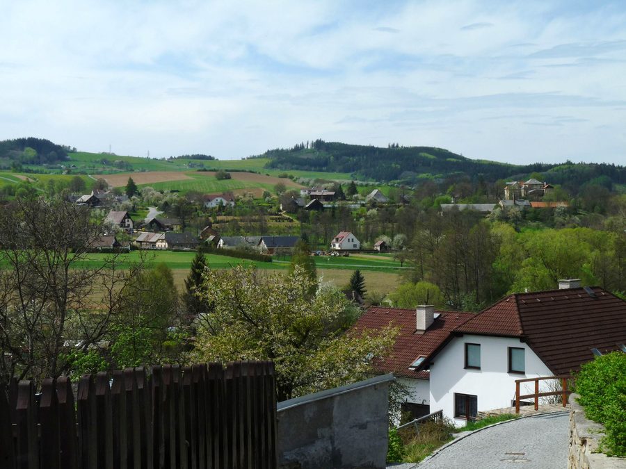 View from Strážov toward the village of Opálka and the hilly landscape in the Klatovy district