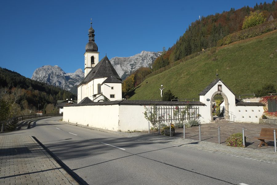 Parish church of St. Sebastian in Ramsau near Berchtesgaden with the Old Cemetery in the foreground