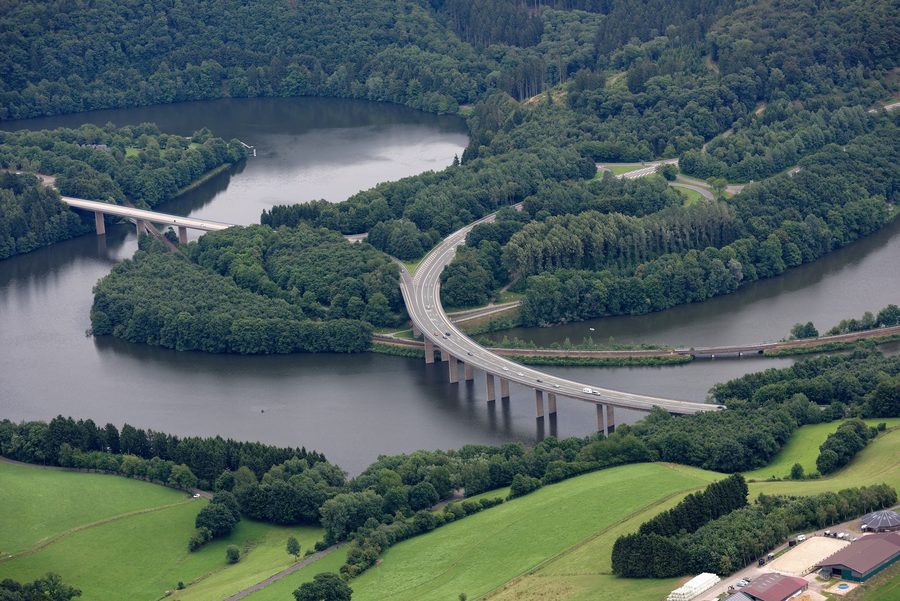 Aerial view of the Biggesee near Olpe with valley bridges and a railway embankment