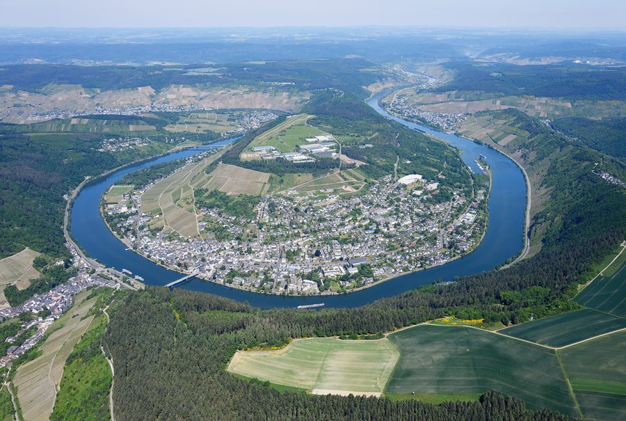 Aerial view of the Moselle near Traben-Trarbach with the river, vineyards, and wooded slopes