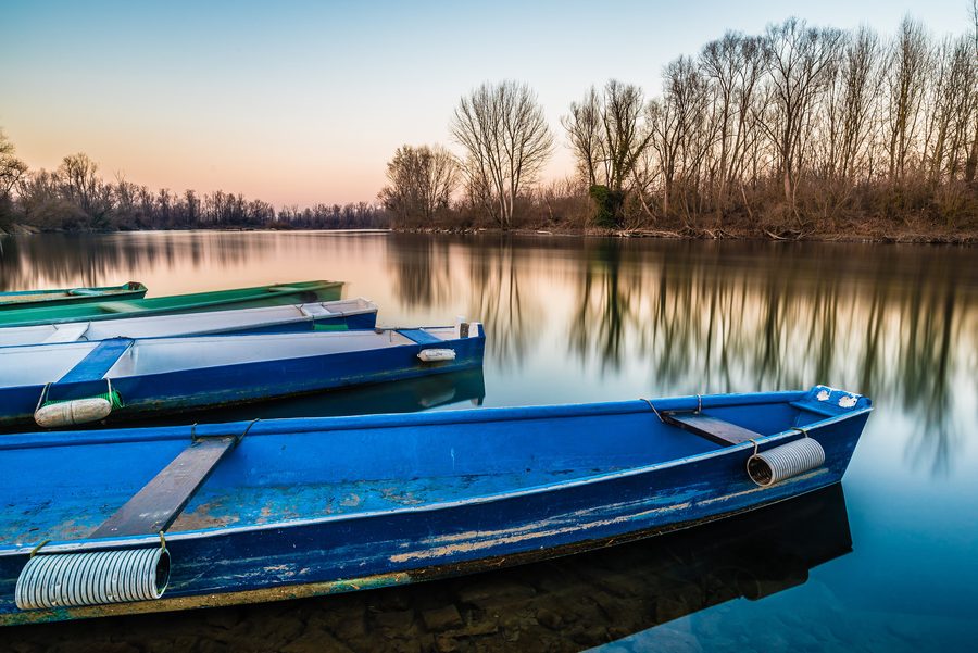 Boats on the Adda near Lodi at sunset