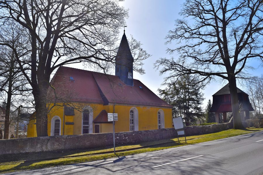 Village church of Arnsdorf with a surrounding wall and separate bell house
