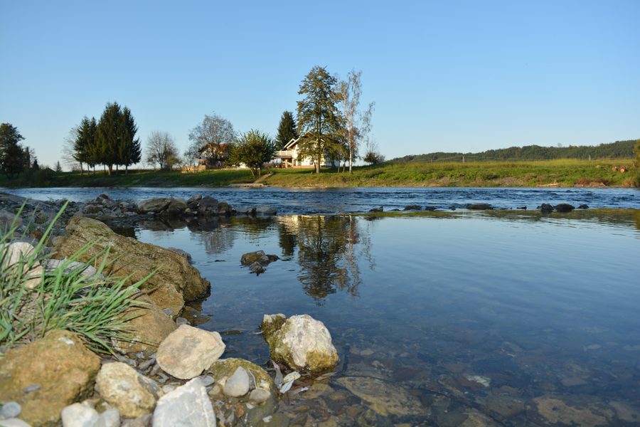The Sana near Prijedor with riverbank scenery and a town setting