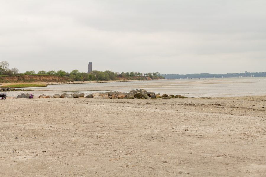 Beach of Stein in the Probstei with the Naval Memorial Laboe in the background