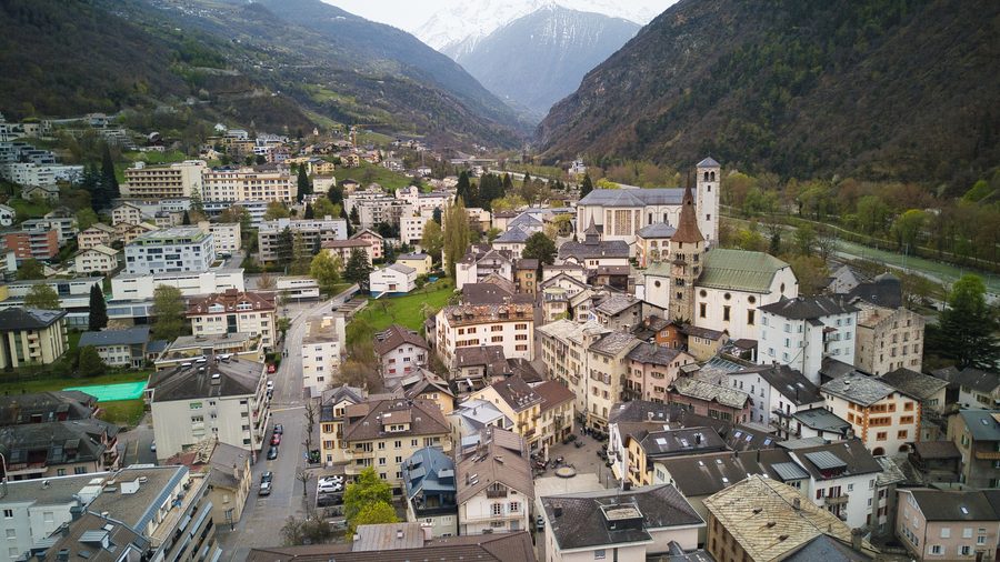 Old town of Visp with a view of the mountains.