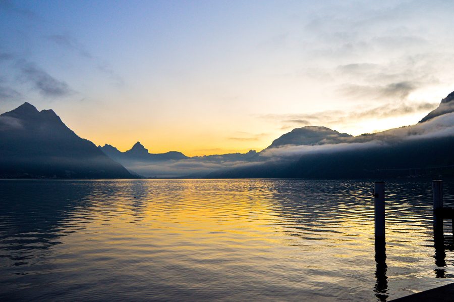 Sunrise over Lake Lucerne near Beckenried with mountains in the background.