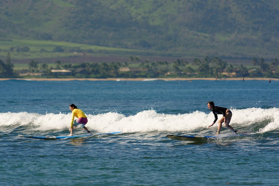 Surfer at Waialua Bay in Haleiwa on Oahu’s North Shore