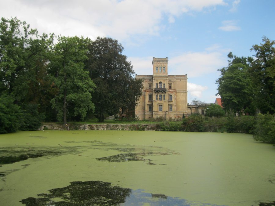 Neo-Renaissance palace in Mrowiny near Żarów, seen from the side of the moat