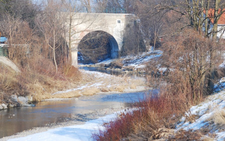 The Triesting passes under the historic aqueduct of the factory canal in Teesdorf.