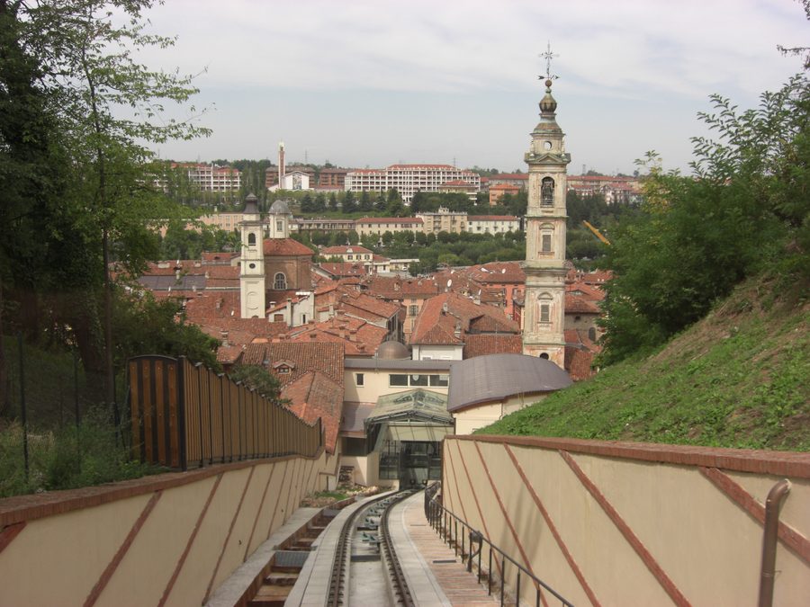 Funicular of Mondovì arriving at Breo station, with the roofs of the Breo district in the background