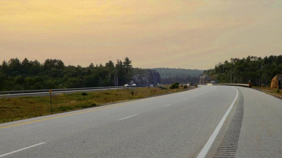 Highway 69 through the forest and lake landscape in the unorganized north of the Sudbury District.
