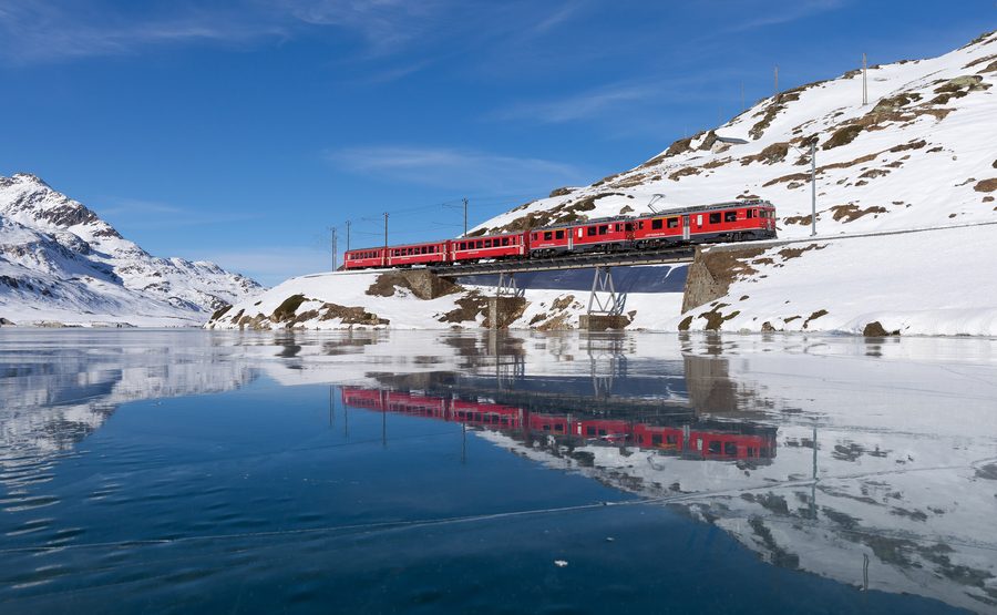 Bernina Railway train on the route to Tirano near Ospizio Bernina