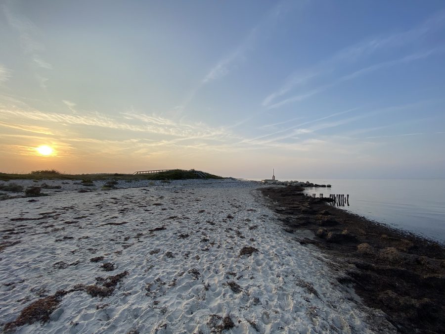 Sandy beach at the Kleiner Binnensee near Behrensdorf with a view of the Baltic Sea