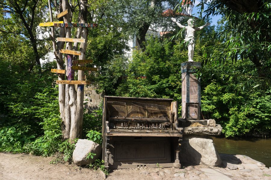 A broken piano displayed in Užupis, Vilnius.