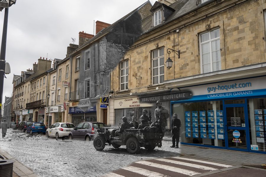 A convoy of Jeeps crosses Holgate Street in Carentan on 14 June 1944