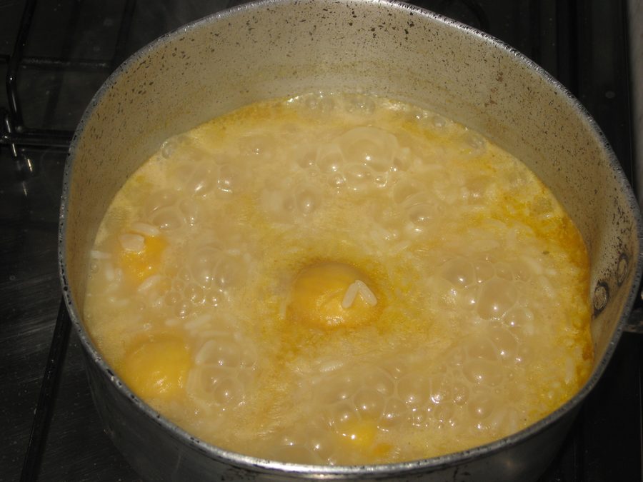 Bowl with arroz com pequi, rice with pequi fruits from the regional cuisine of Goiás