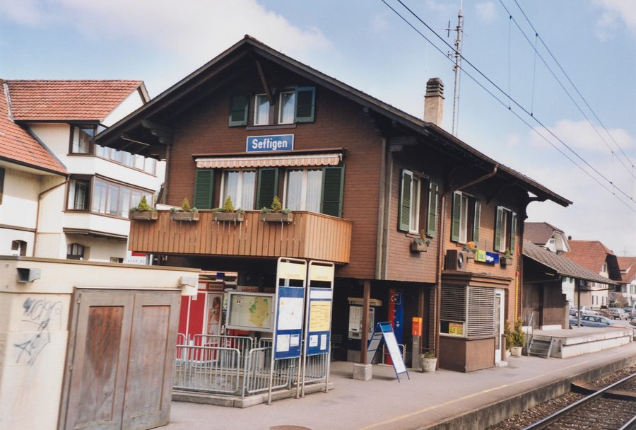 Historic Seftigen station building with goods shed on the track side
