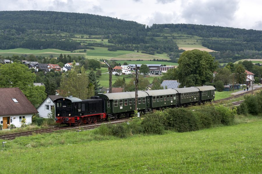 Historic V 36 204 locomotive of the Sauschwänzlebahn with passenger cars in the Wutach Valley