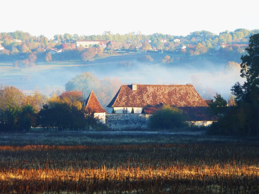 South side of Château de Beauséjour in Tocane-Saint-Apre, with the hills of Montagrier in the background