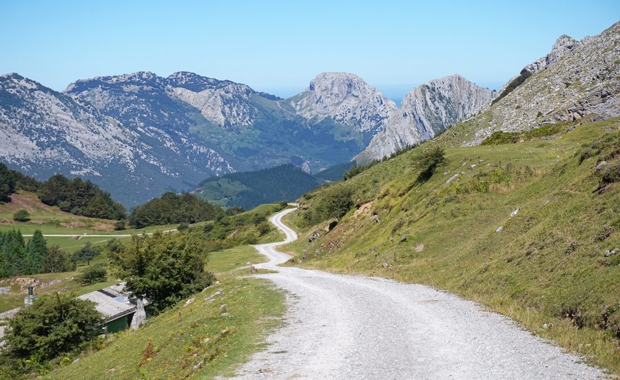 Road through Urkiola Natural Park with mountain landscape in the background