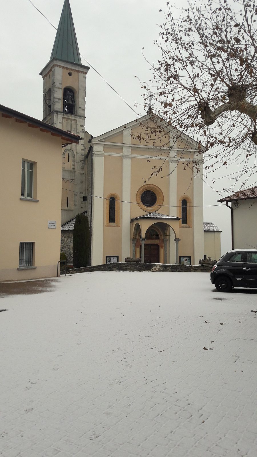 Panorama of Germasino with church, clubhouse and town hall in front of the mountain landscape