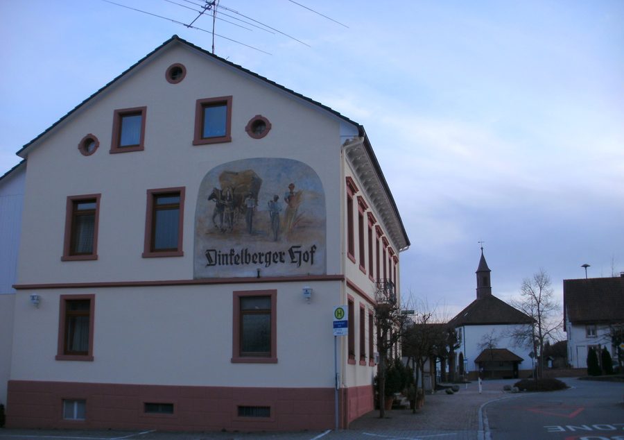 Village center of Adelhausen with the former Dinkelberger Hof inn and a facade fresco