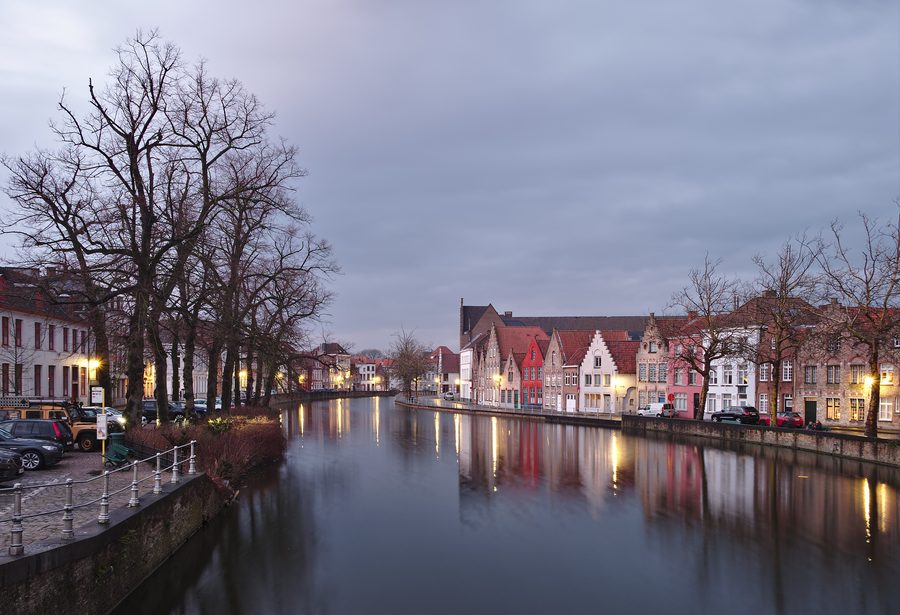 Historic waterway in Bruges with houses and bridge