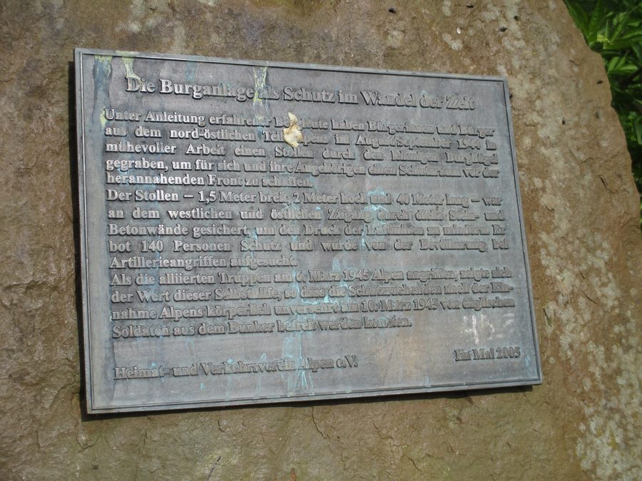 Motte of the lowland castle of Alpen with memorial plaque and access to the protective tunnel