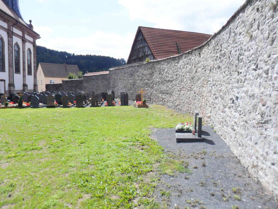 Former church fortress cemetery in Schleid with the cemetery wall