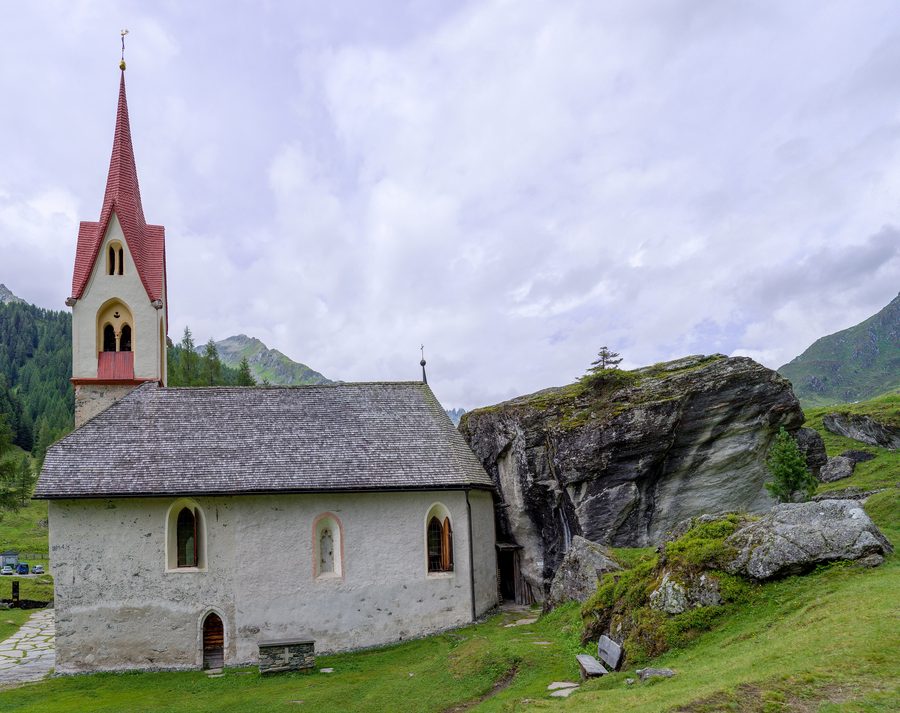 Holy Spirit chapel in Prettau, South Tyrol, built behind a rock to protect it from snow avalanches