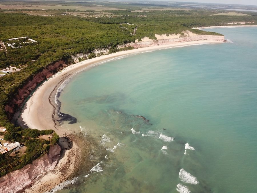 Aerial view of BaÃa dos Golfinhos near Pipa with bay, beach, and coastline