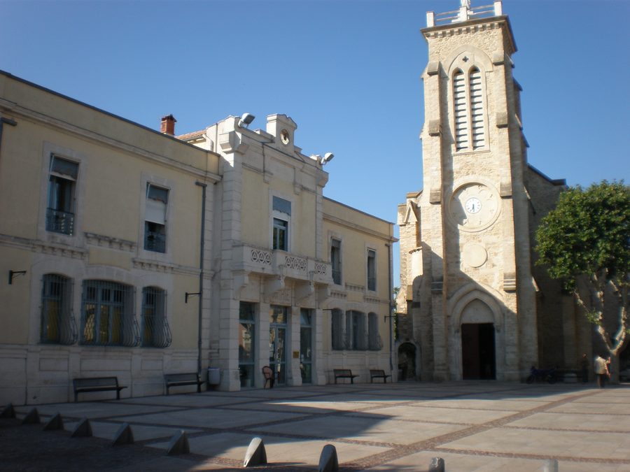 Town hall and church of the Transfiguration of the Lord and Saint-Sixte II in Pérols, Hérault