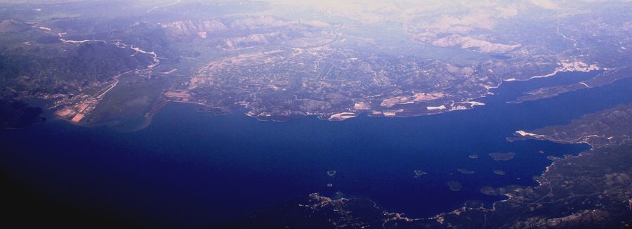 Aerial view of the Neretva Delta with agricultural fields and a coastal landscape in Dubrovnik-Neretva County