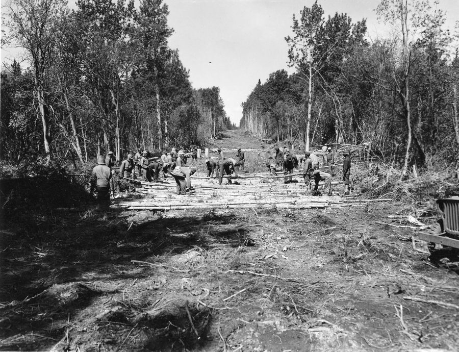 Historical photo of a Corduroy road under construction on the Alaska Highway near Charlie Lake in the Fort St. John area
