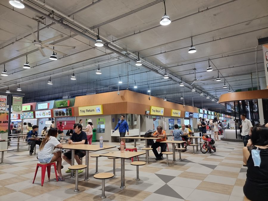 Interior of Woodleigh Village Hawker Centre with various food stalls